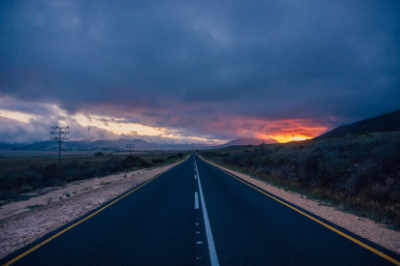 Desert road with sundawn